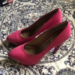 Pink leather suede pumps with metallic accents.